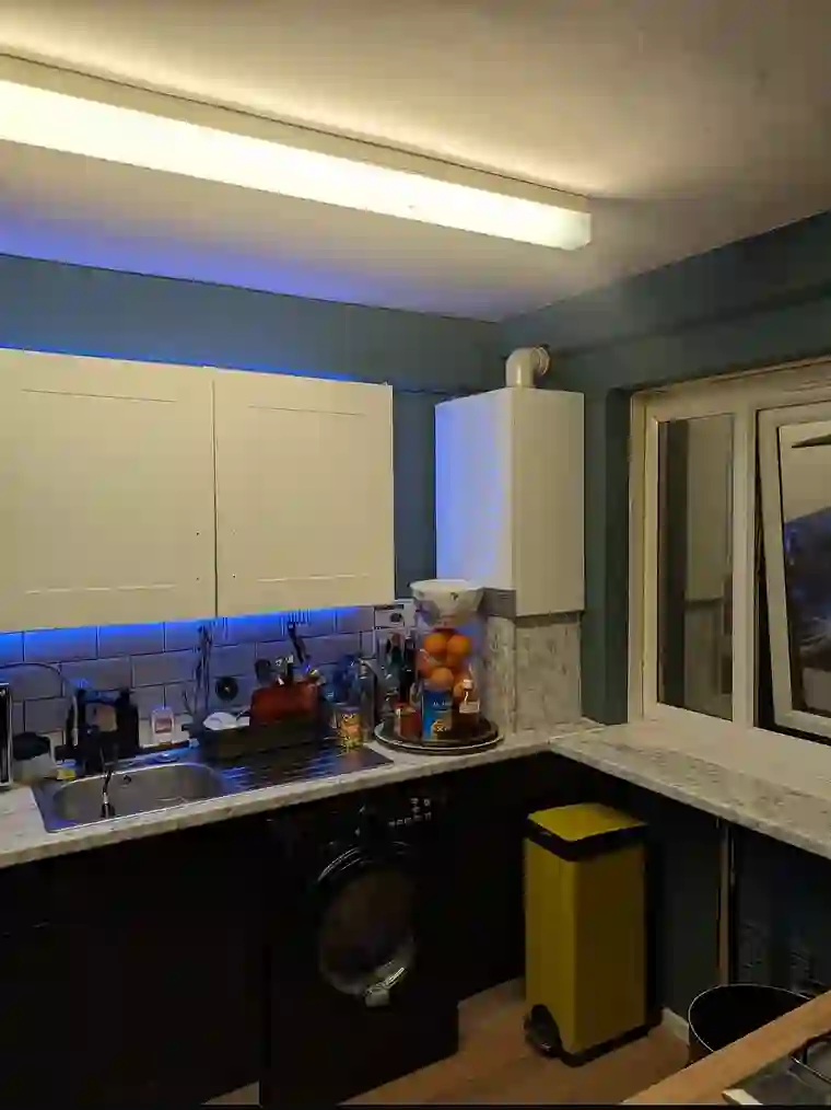 Kitchen renovation after — modern finished kitchen with LED lighting, by GTH Maintenance
